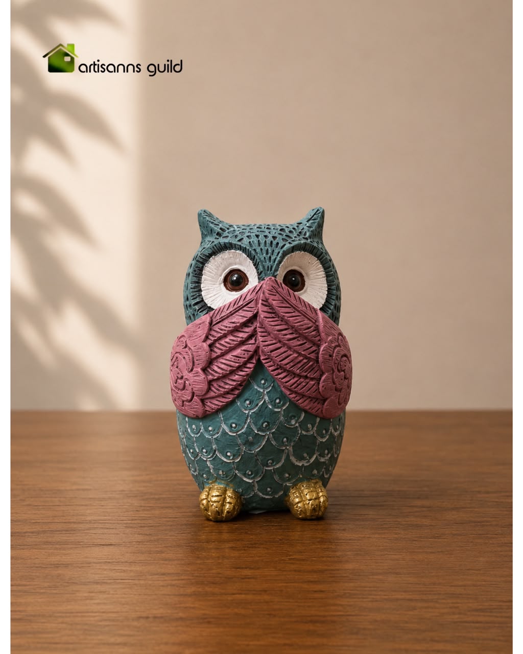 Speak no evil” owl figurine